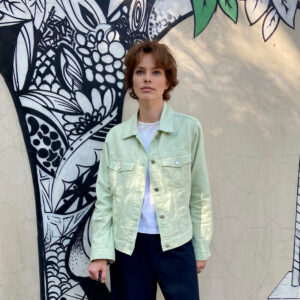 The pattern of a denim jacket of moderate volume, straight silhouette.