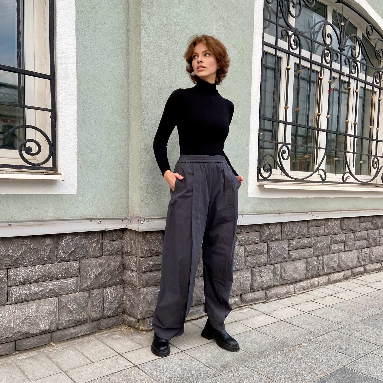 043 Pattern of trousers with decorative pleats on the front halves. The silhouette is narrowed down. Pockets in the side seams. The back halves of the trousers consist of two parts. There are pockets with a leaf on the back halves. The waistband of the trousers is assembled with an elastic band